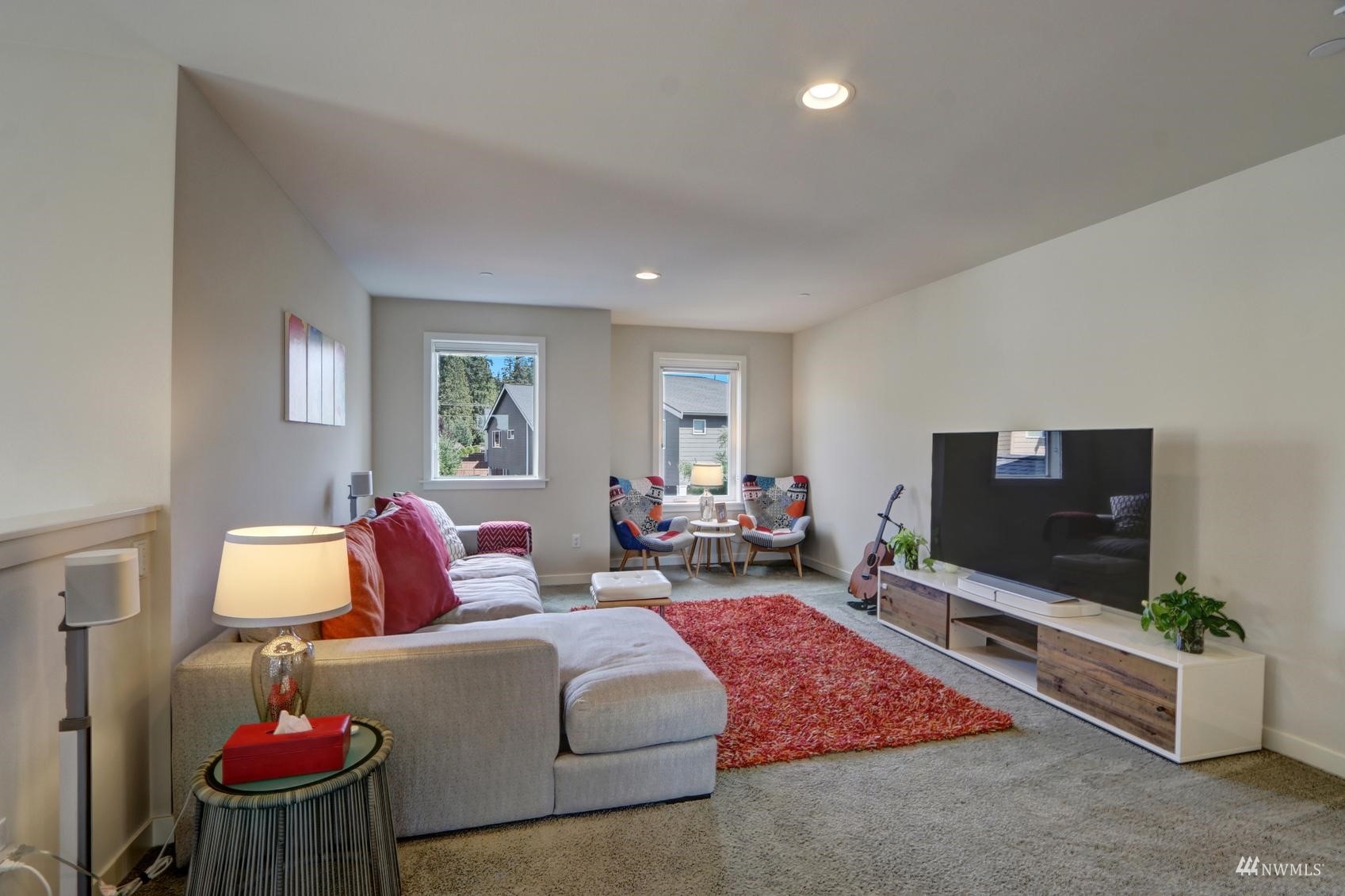 4321 231st Place Southeast Bothell, WA 98021 - Photo 24 of 40 a living room with furniture and a flat screen tv