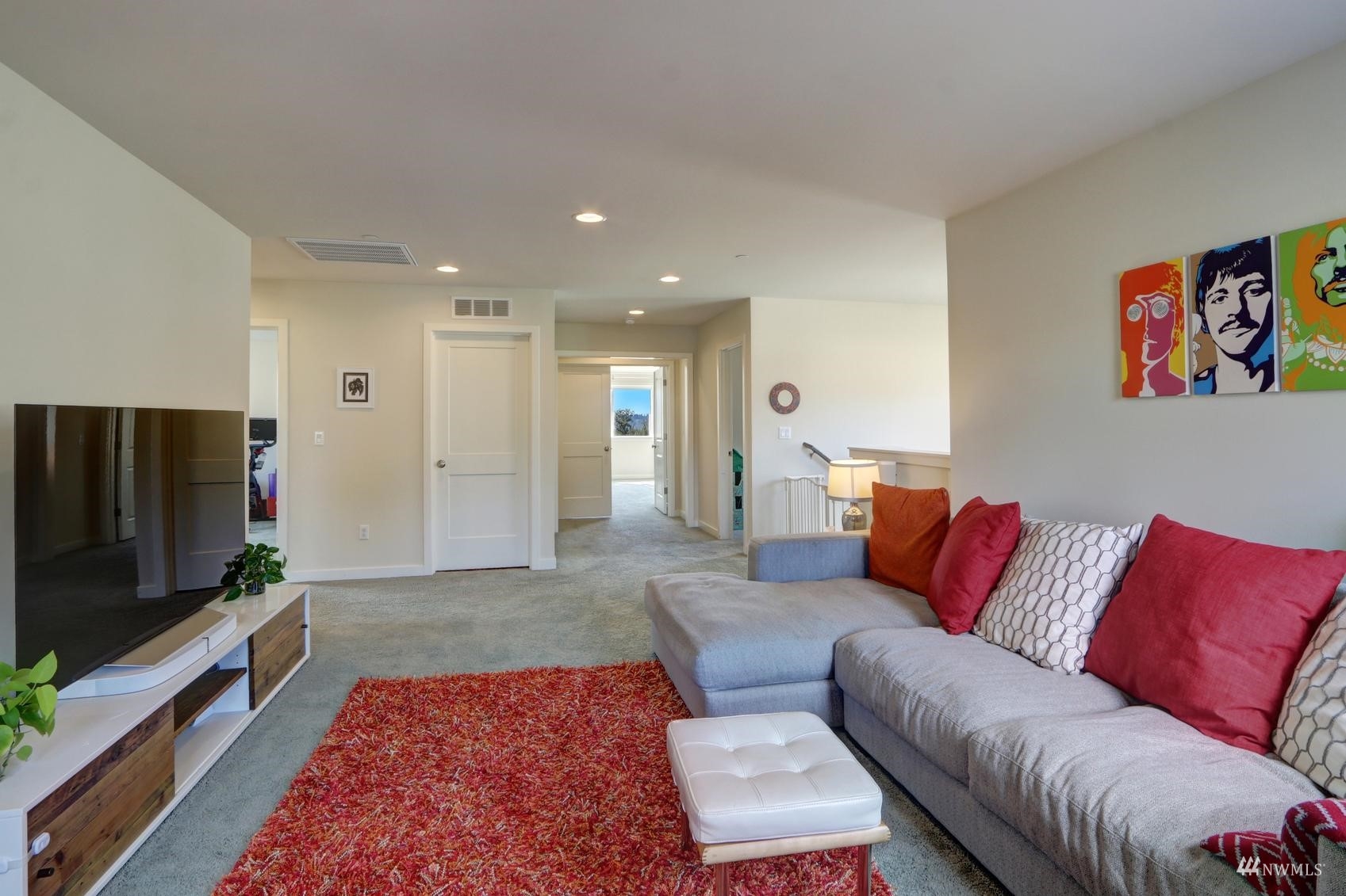 4321 231st Place Southeast Bothell, WA 98021 - Photo 25 of 40 a living room with furniture and a flat screen tv