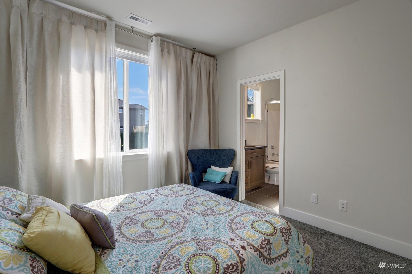 4321 231st Place Southeast Bothell, WA 98021 - Photo 27 of 40 a bedroom with a bed and a window