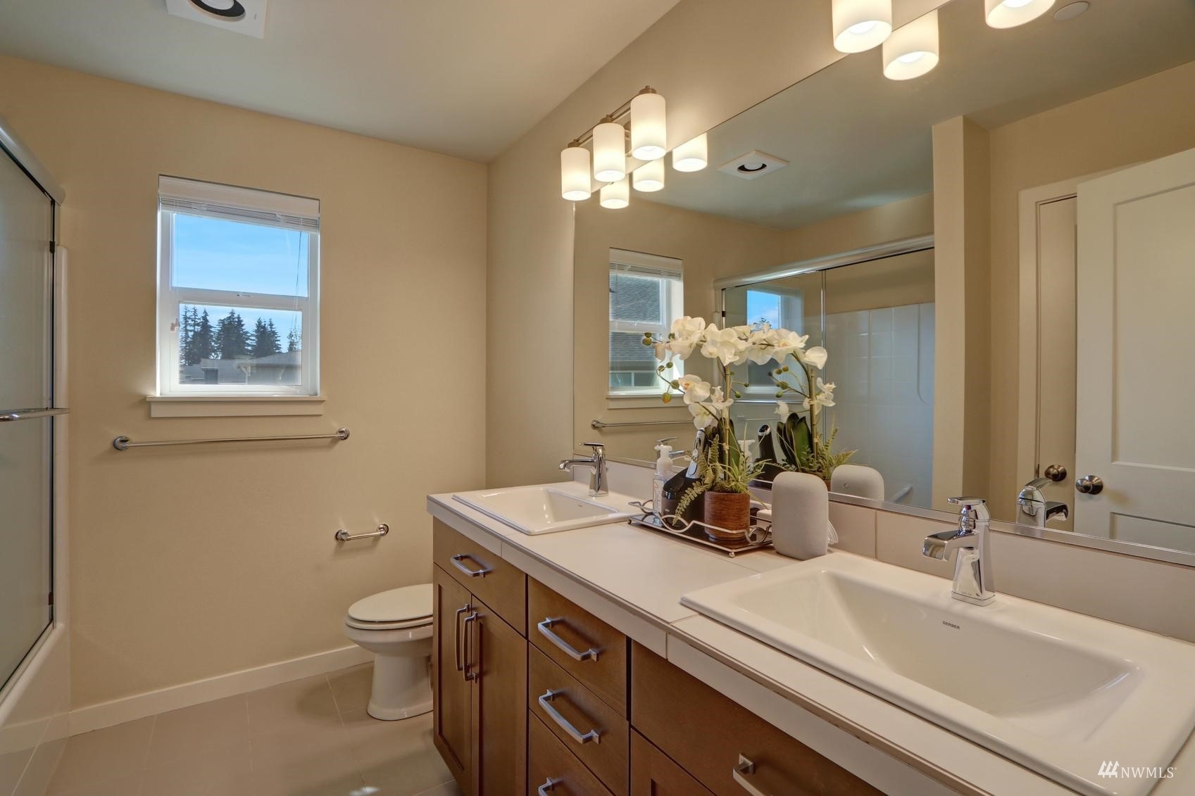 4321 231st Place Southeast Bothell, WA 98021 - Photo 30 of 40 a bathroom with a toilet sink and mirror