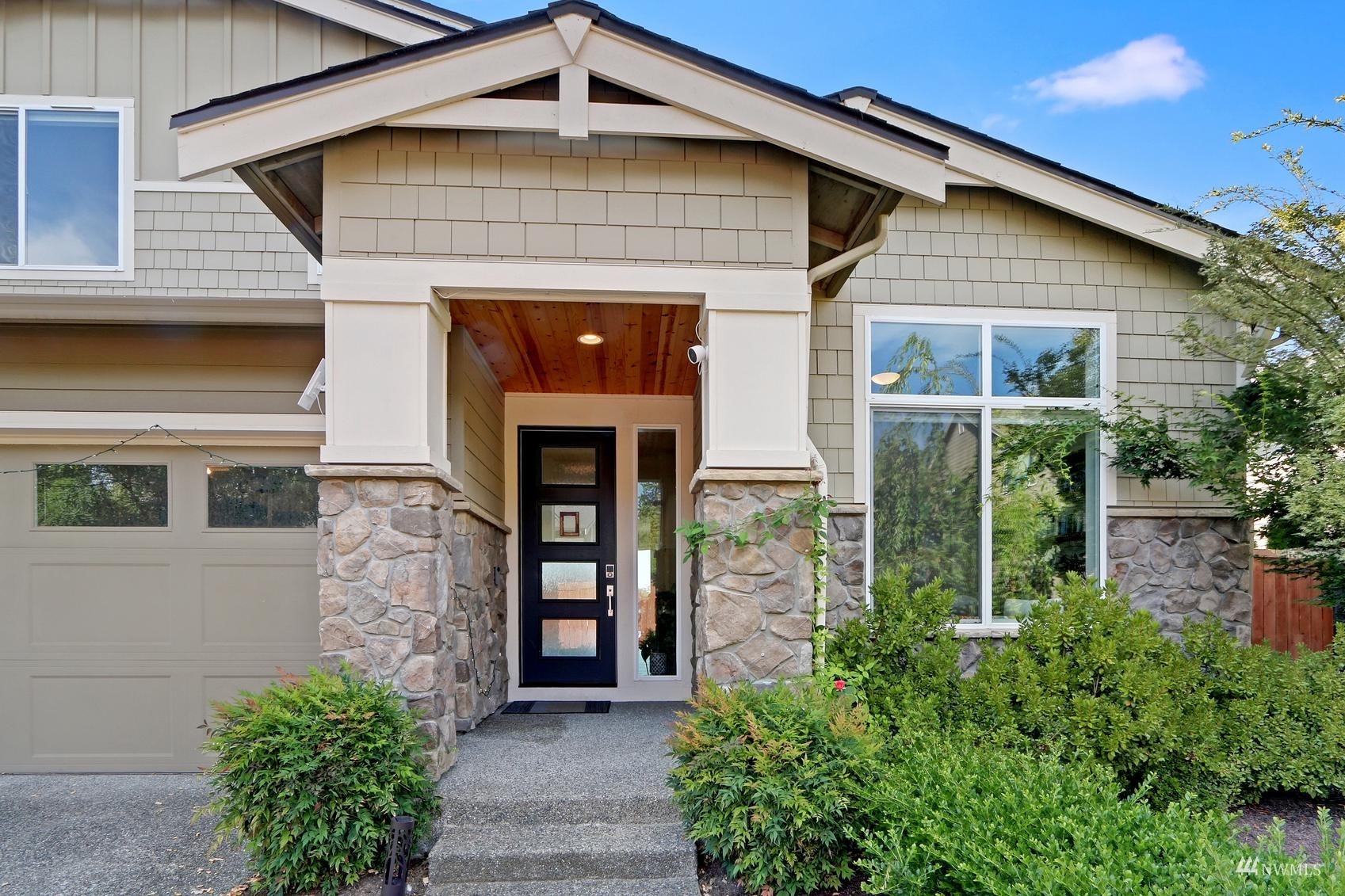 4321 231st Place Southeast Bothell, WA 98021 - Photo 3 of 40 a front view of a house with garden