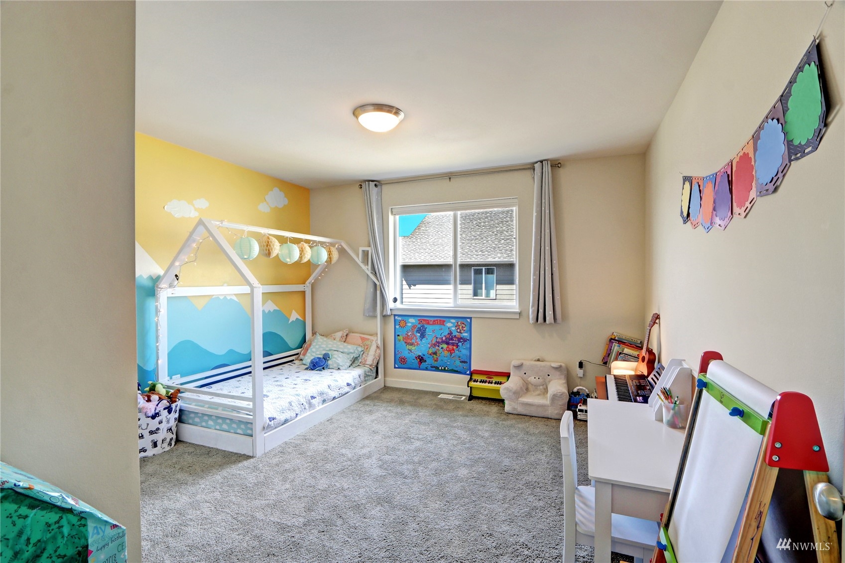 4321 231st Place Southeast Bothell, WA 98021 - Photo 31 of 40 a bedroom with furniture and a lamp