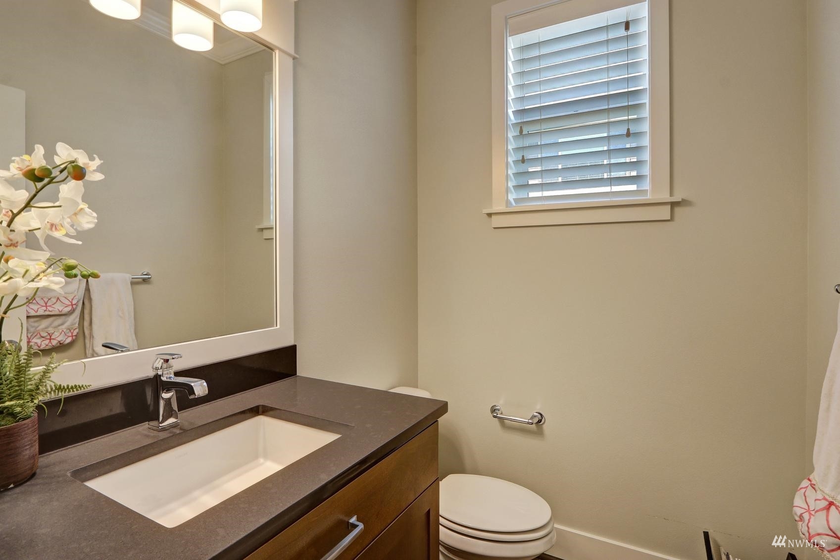 4321 231st Place Southeast Bothell, WA 98021 - Photo 34 of 40 a bathroom with a sink vanity granite toilet and a mirror