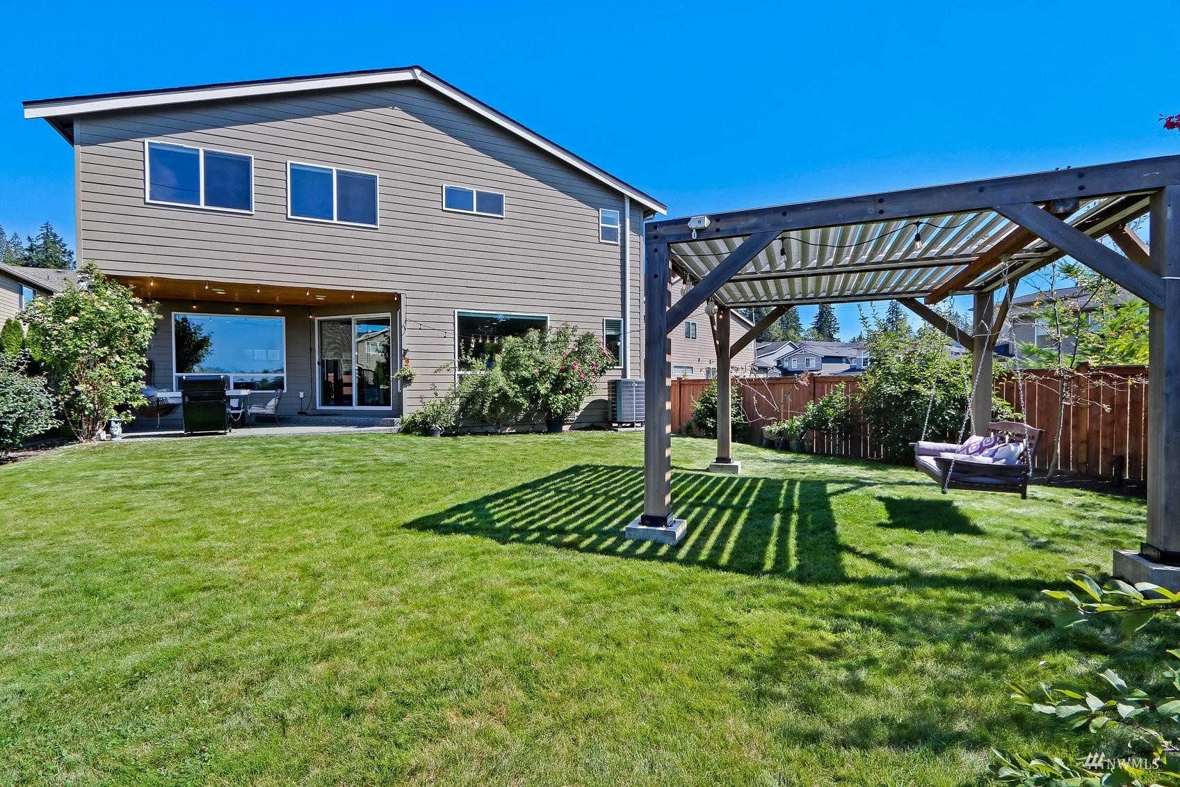 4321 231st Place Southeast Bothell, WA 98021 - Photo 35 of 40 a view of backyard with table and chairs and potted plants