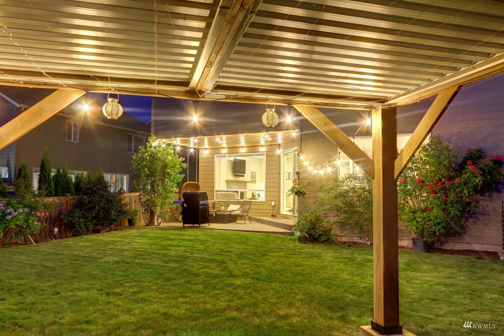 4321 231st Place Southeast Bothell, WA 98021 - Photo 37 of 40 a view of a porch with a table and chairs and potted plants