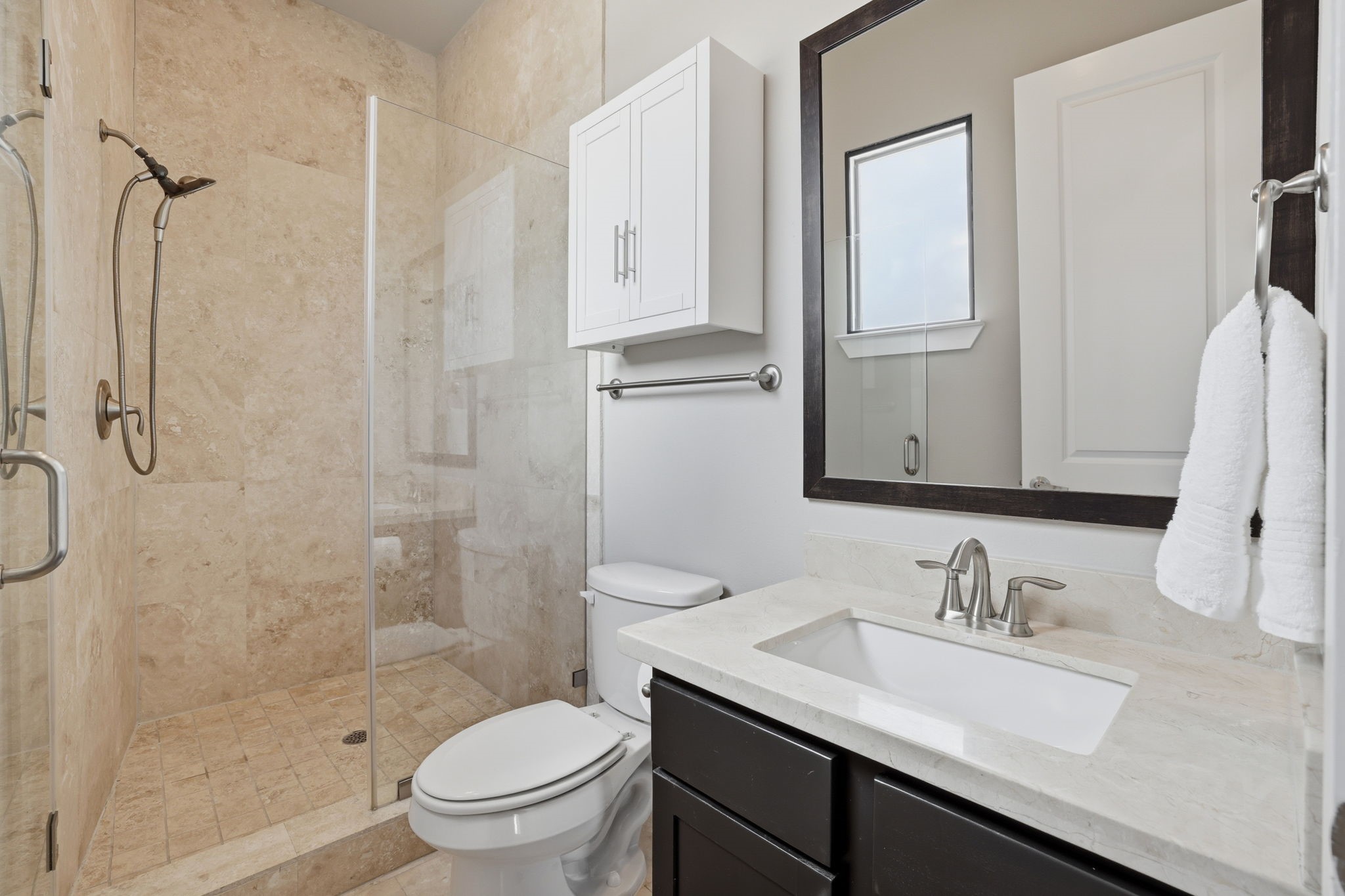 4102 Marina Street Houston, TX 77007 - Photo 25 of 32 Secondary bedroom ensuite bathroom with beautiful marble countertops and gorgeous walk-in shower.
