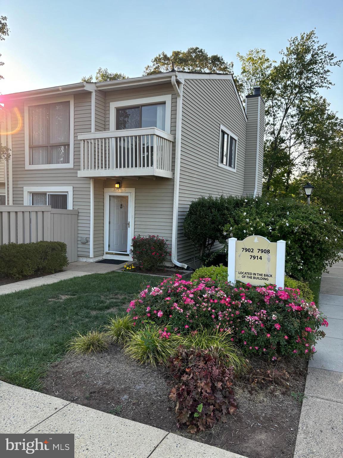 7900 Spring Forest Court Springfield, VA 22152 - Photo 2 of 40 a front view of a house with a yard and garage