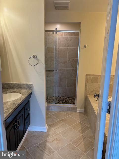 7900 Spring Forest Court Springfield, VA 22152 - Photo 24 of 40 a bathroom with a granite countertop sink a toilet and shower