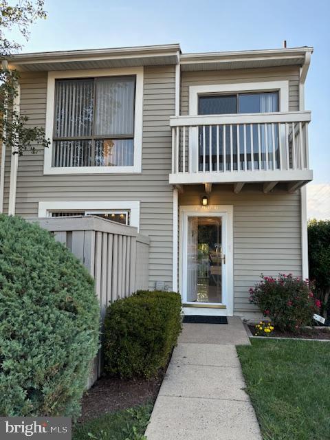 7900 Spring Forest Court Springfield, VA 22152 - Photo 3 of 40 a view of a house with a small yard and plants