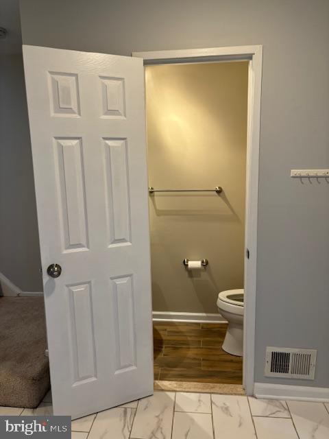 7900 Spring Forest Court Springfield, VA 22152 - Photo 35 of 40 a bathroom with a toilet and a shower