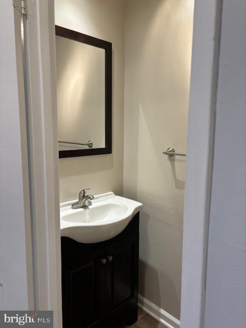 7900 Spring Forest Court Springfield, VA 22152 - Photo 36 of 40 a bathroom with a sink and a mirror