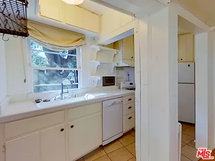 a bathroom with a double vanity sink and mirror