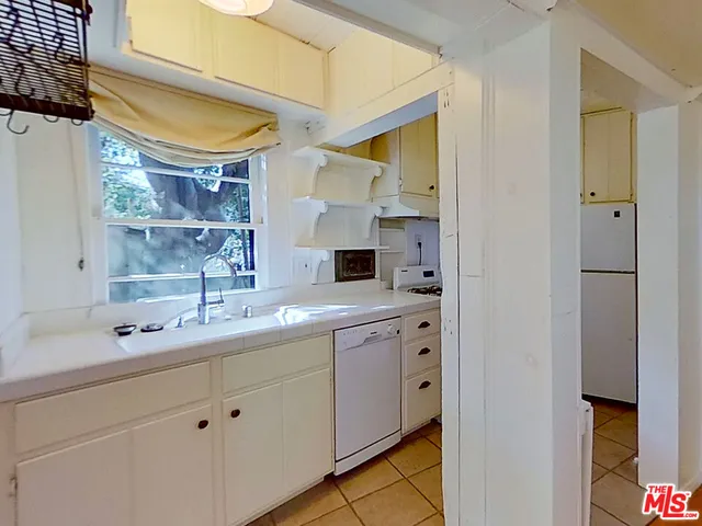 a bathroom with a double vanity sink and mirror