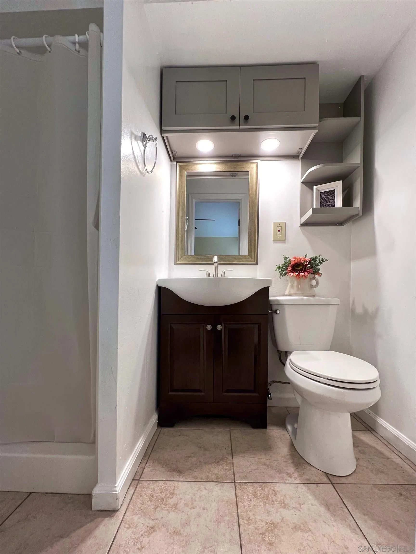 714 Convertible Lane Fallbrook, CA 92028 - Photo 15 of 28 a bathroom with a toilet sink and mirror