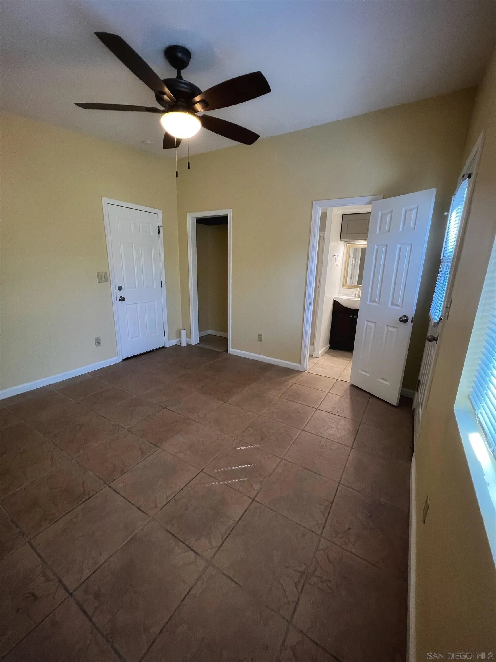 714 Convertible Lane Fallbrook, CA 92028 - Photo 16 of 28 a view of a livingroom with a ceiling fan and window
