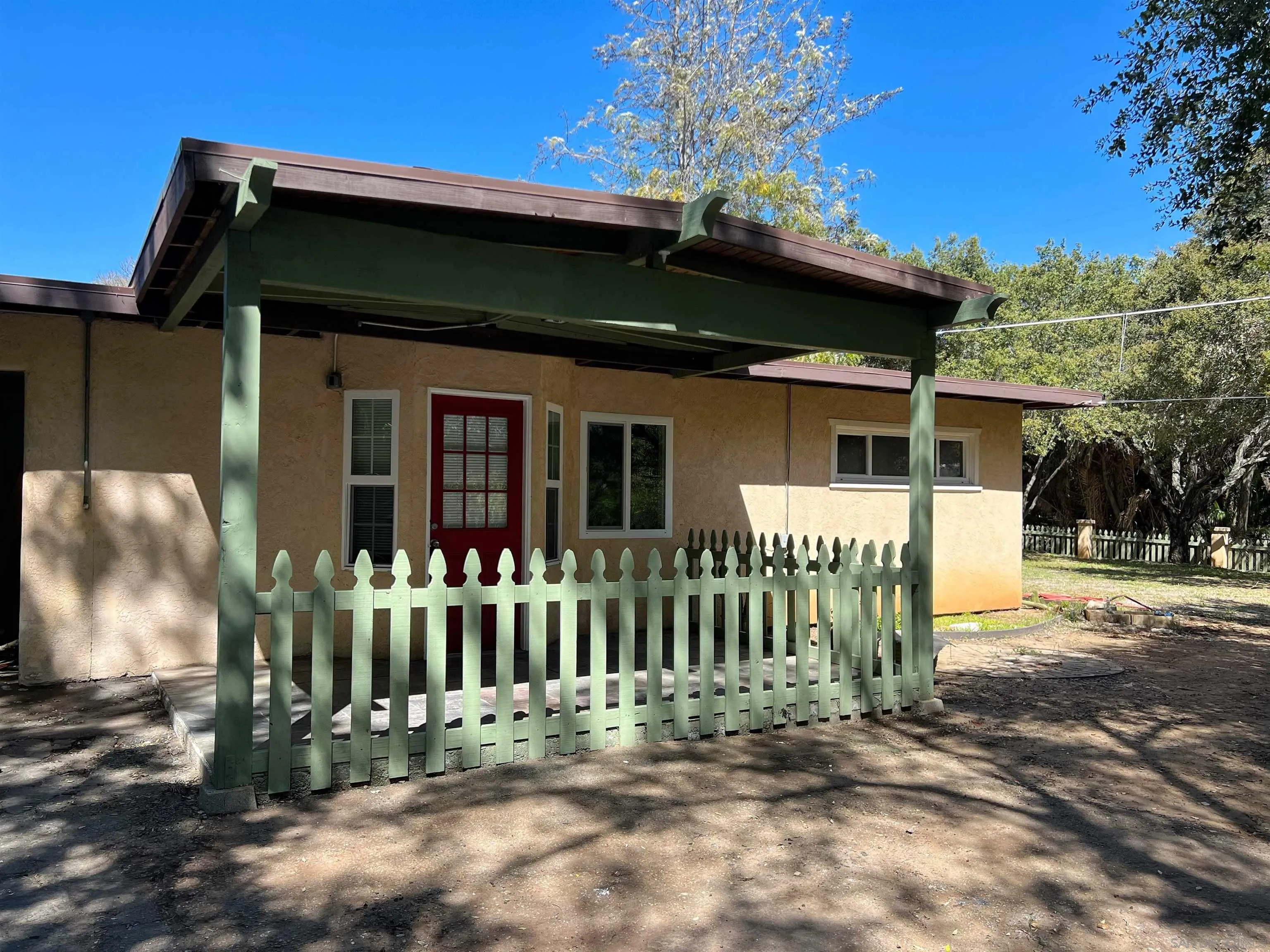 714 Convertible Lane Fallbrook, CA 92028 - Photo 20 of 28 a front view of a house with a garden