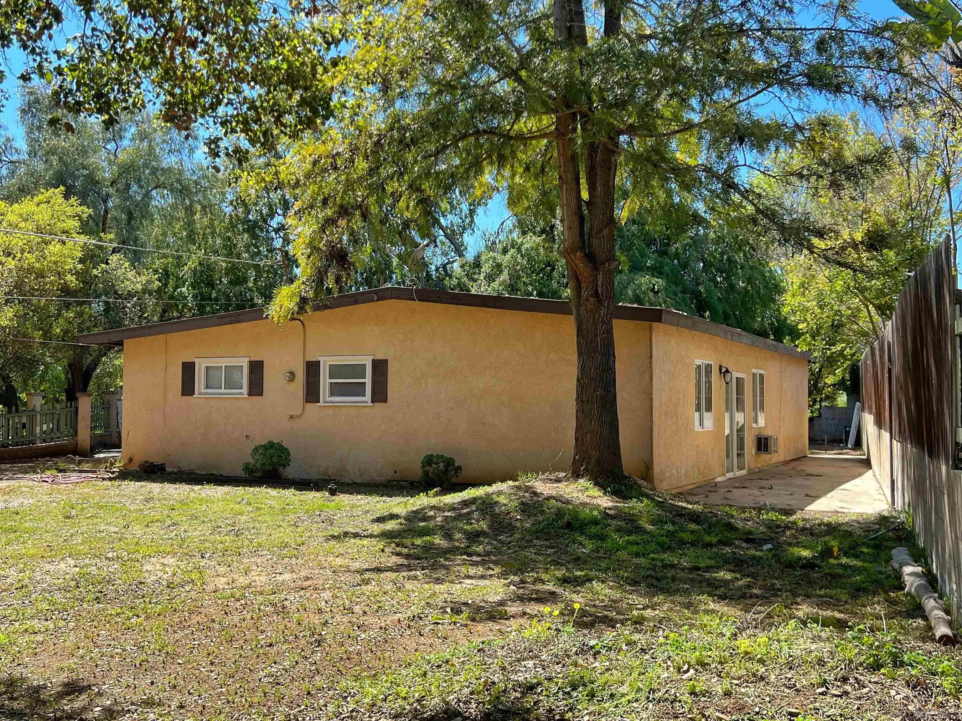 714 Convertible Lane Fallbrook, CA 92028 - Photo 3 of 28 a house with trees in front of it