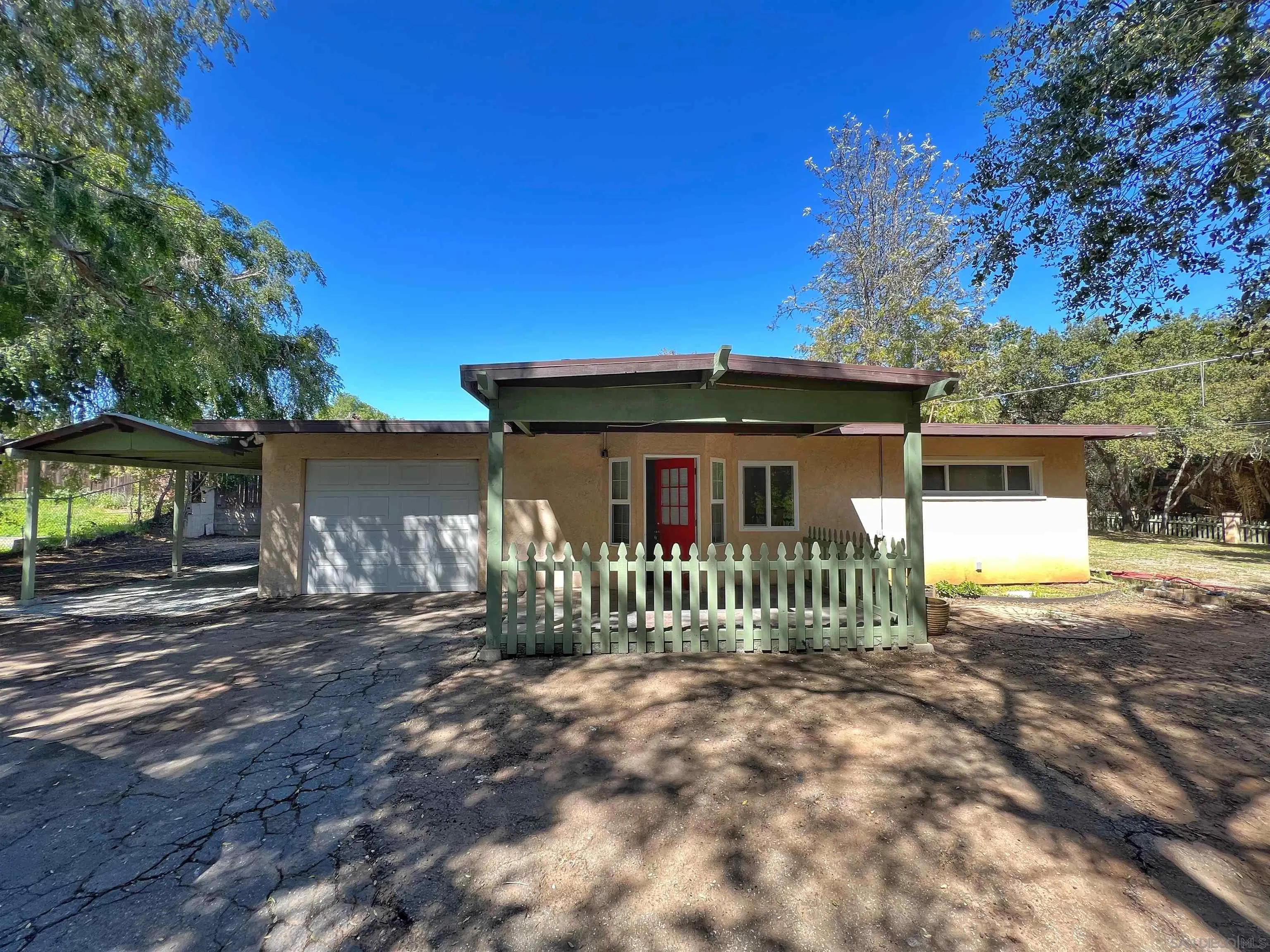 714 Convertible Lane Fallbrook, CA 92028 - Photo 5 of 28 a front view of a house with a yard