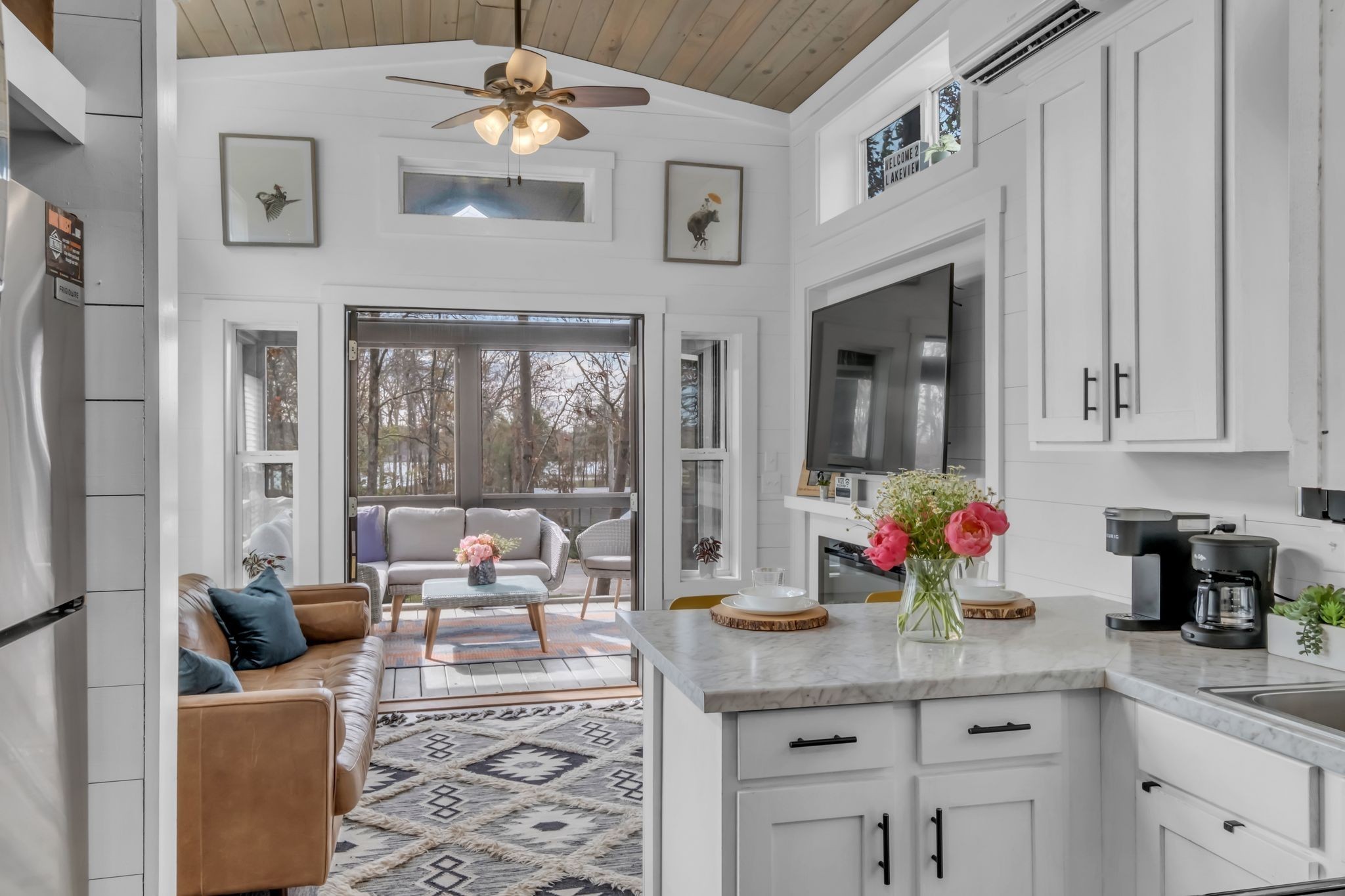 672 Waters Edge Way Tracy City, TN 37387 - Photo 2 of 81 a living room with furniture a chandelier and a fireplace