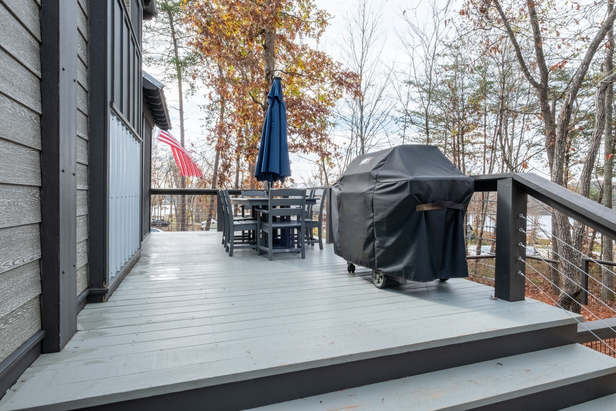672 Waters Edge Way Tracy City, TN 37387 - Photo 25 of 81 a view of a patio with a table chairs and a barbeque