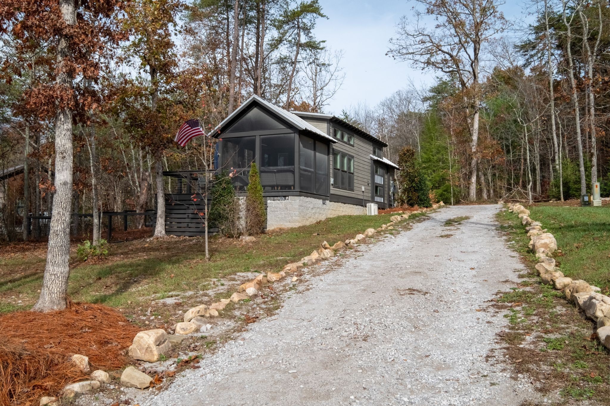 672 Waters Edge Way Tracy City, TN 37387 - Photo 28 of 81 a front view of a house with a yard covered with snow