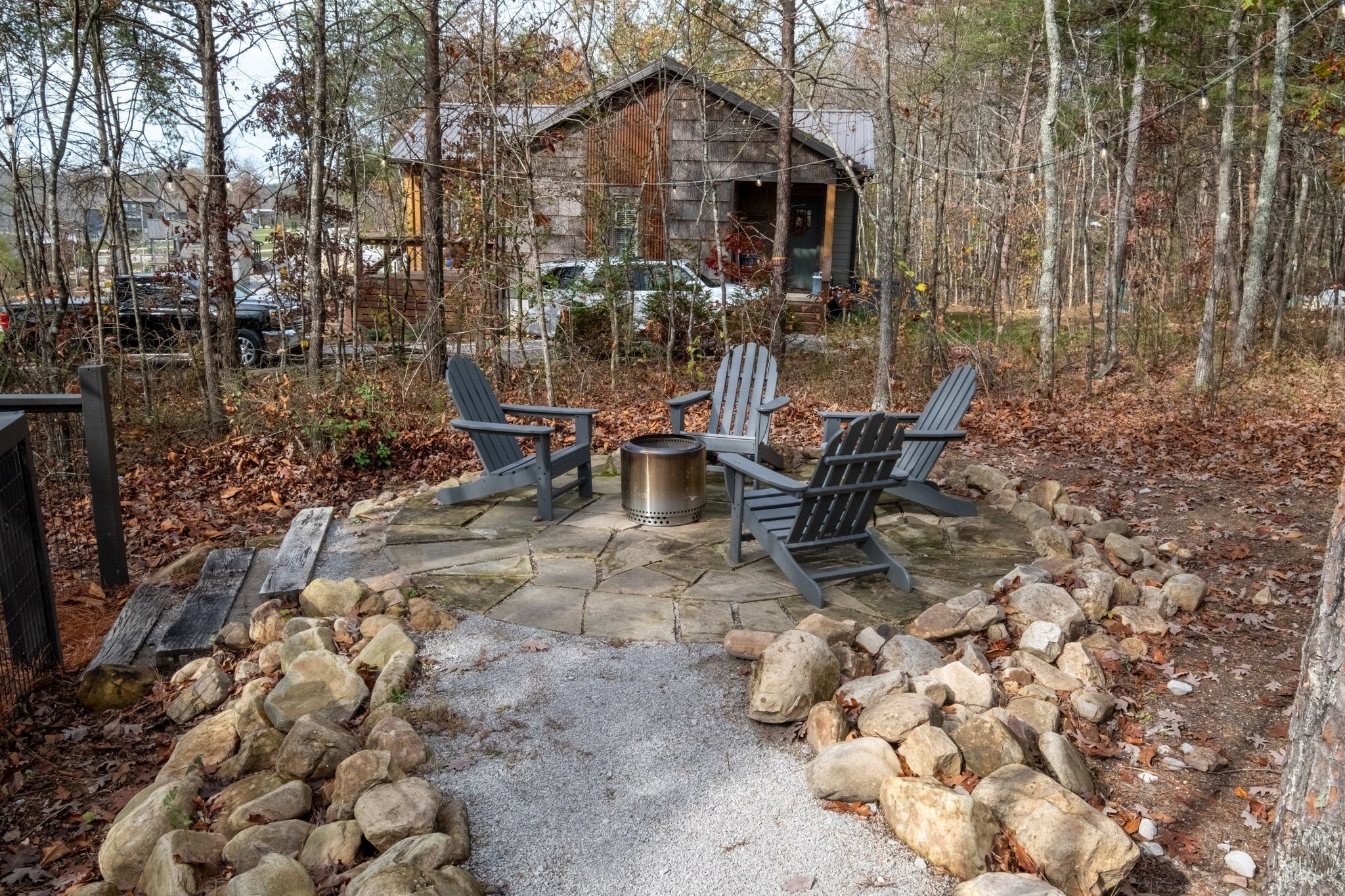 672 Waters Edge Way Tracy City, TN 37387 - Photo 31 of 81 a view of a chairs and table in backyard