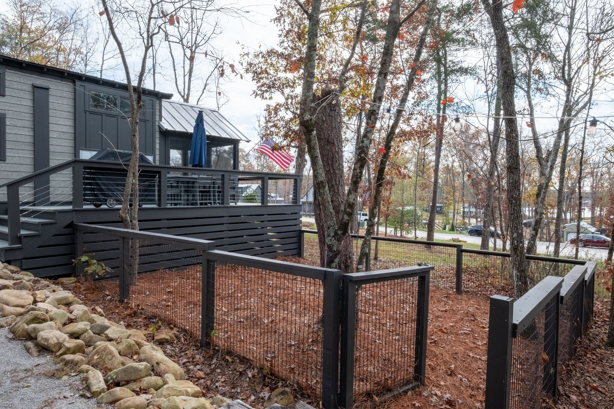 672 Waters Edge Way Tracy City, TN 37387 - Photo 35 of 81 a view of backyard with wooden fence and large trees