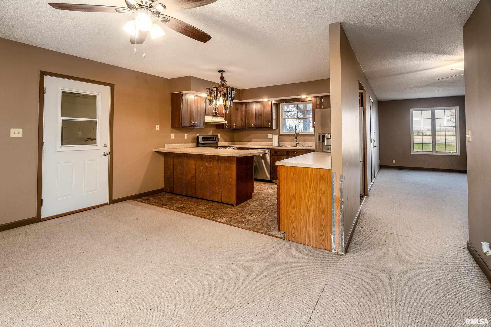 18662 Liberty School Road Thompsonville, IL 62890 - Photo 12 of 32 a large kitchen with cabinets and stainless steel appliances