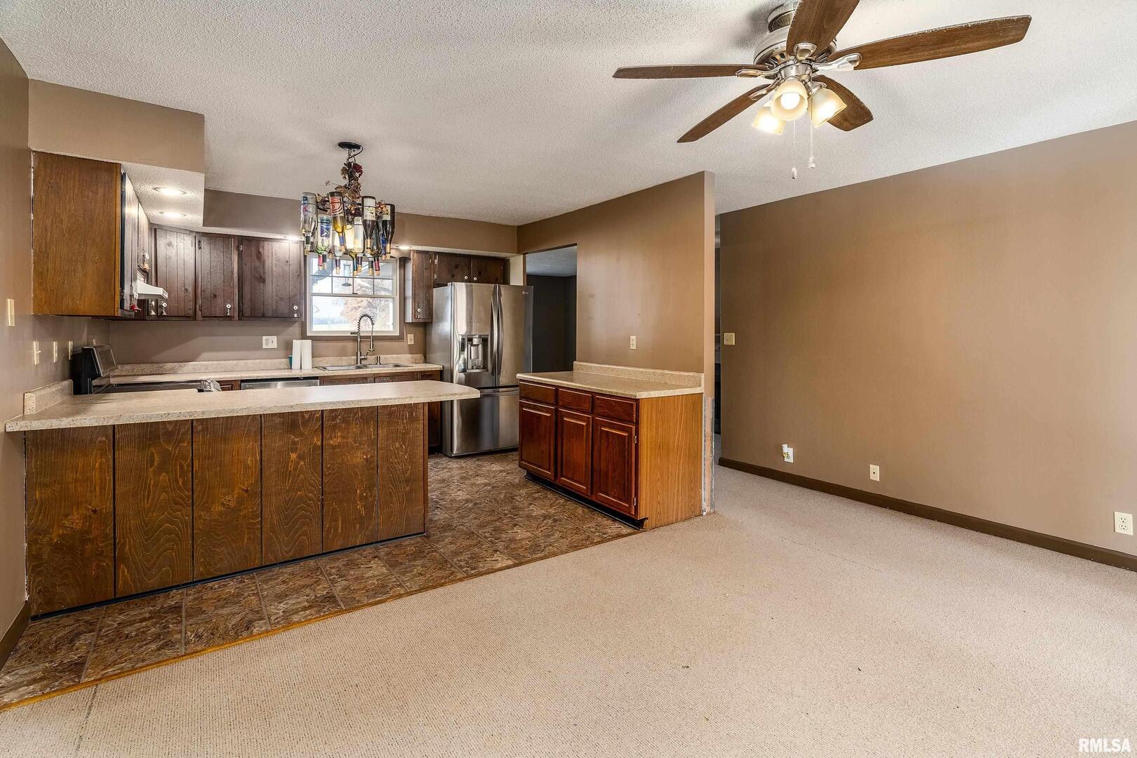 18662 Liberty School Road Thompsonville, IL 62890 - Photo 13 of 32 a kitchen with stainless steel appliances a sink and a refrigerator
