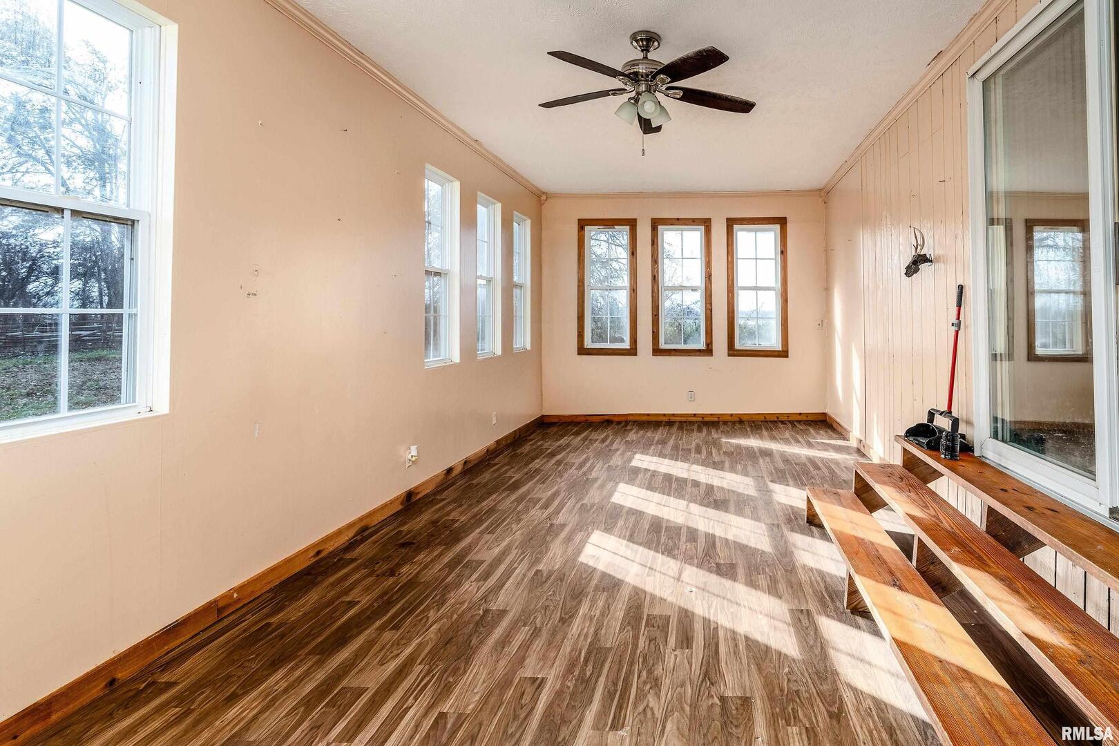18662 Liberty School Road Thompsonville, IL 62890 - Photo 19 of 32 a view of a room with wooden floor and windows