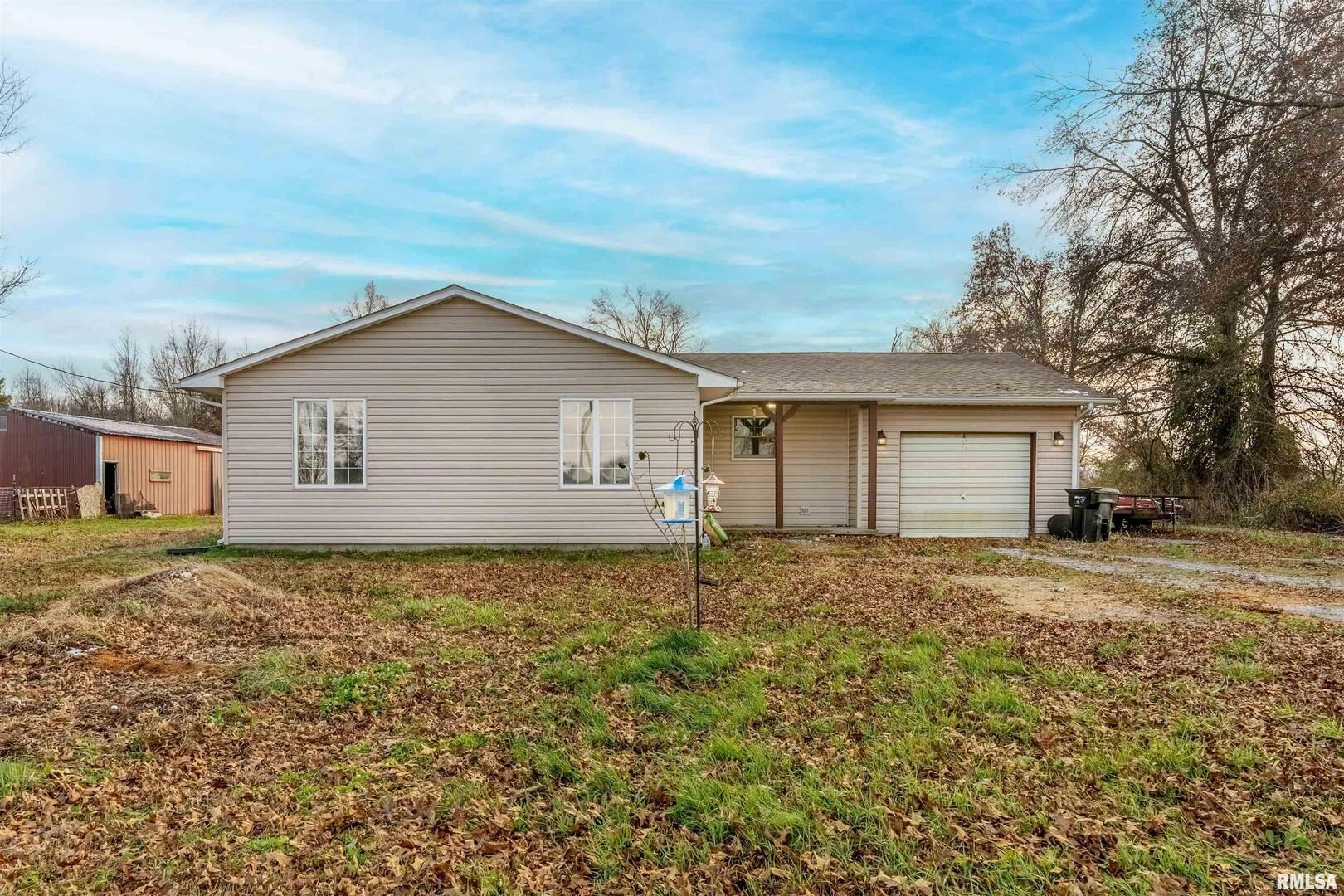 18662 Liberty School Road Thompsonville, IL 62890 - Photo 2 of 32 a house with trees in the background