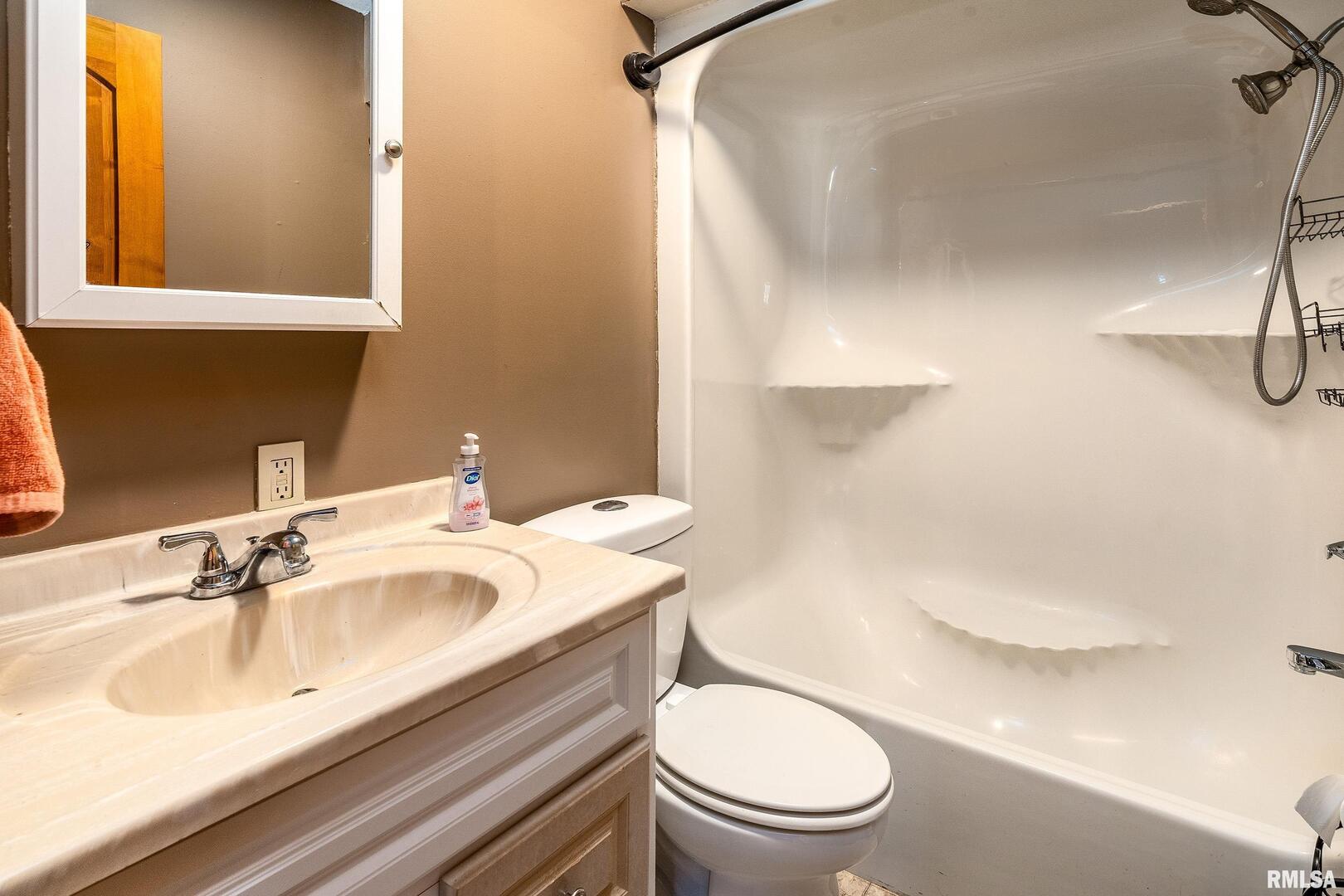 18662 Liberty School Road Thompsonville, IL 62890 - Photo 24 of 32 a bathroom with a sink a toilet and a mirror