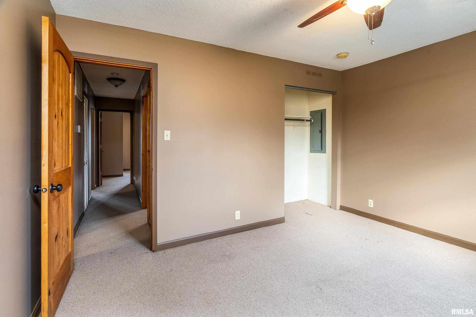 18662 Liberty School Road Thompsonville, IL 62890 - Photo 26 of 32 a view of an empty room with a ceiling fan