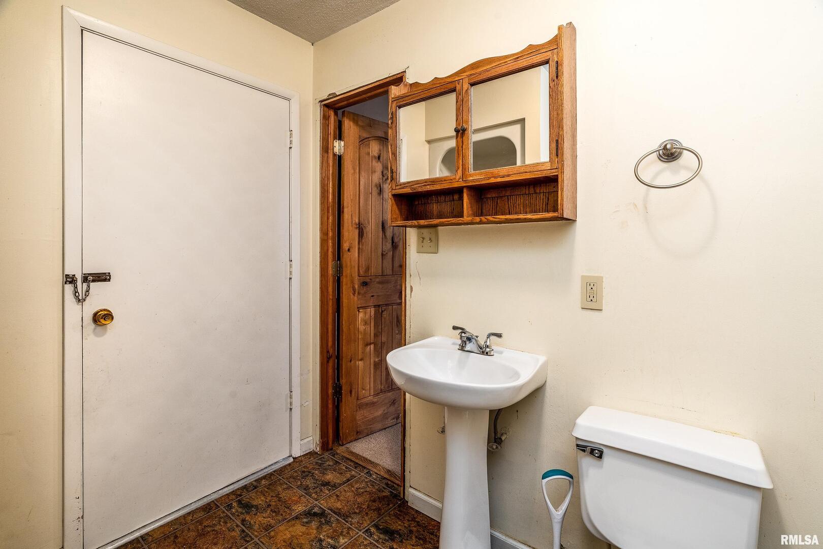 18662 Liberty School Road Thompsonville, IL 62890 - Photo 28 of 32 a bathroom with a sink toilet and shower
