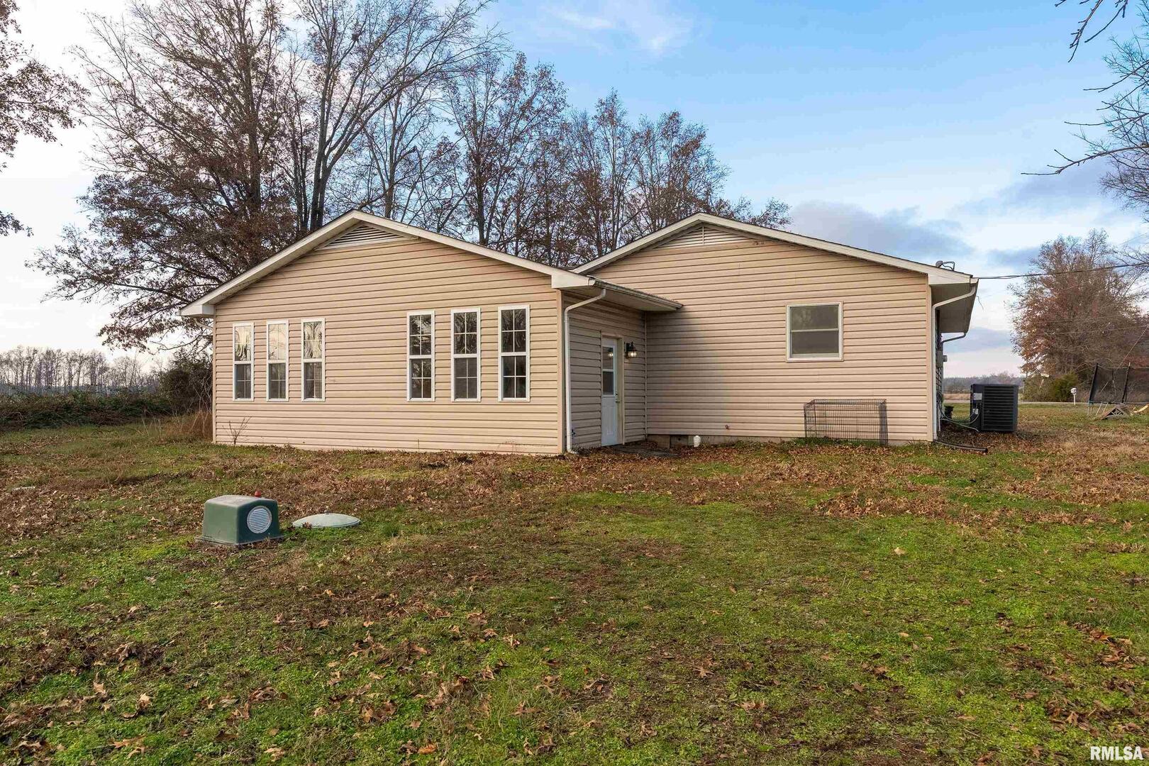 18662 Liberty School Road Thompsonville, IL 62890 - Photo 30 of 32 a view of a house with a yard
