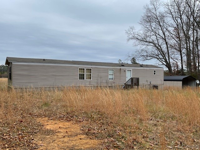 21404 Landora Bridge Road Ruther Glen, VA 22546 - Photo 5 of 6 a house view with a backyard space