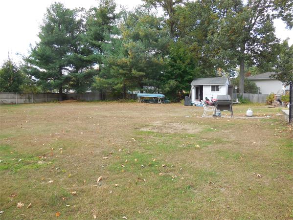4 Belanger Road Southampton, MA 01073 - Photo 7 of 17 a backyard of a house with table and chairs