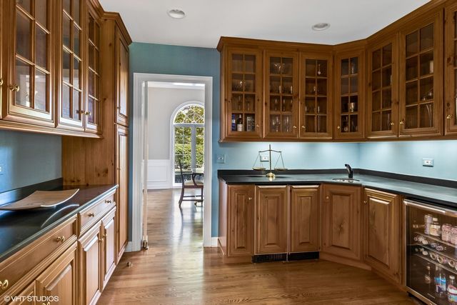 a view of a building with a table and chairs