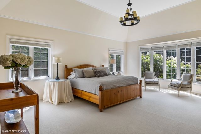 a bathroom with a double vanity sink a mirror and a shower