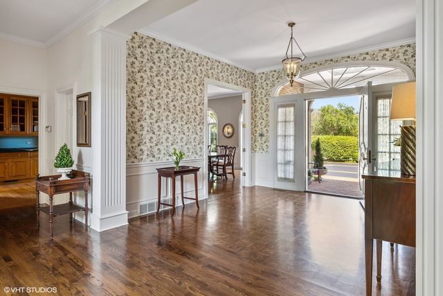 a view of a livingroom with furniture window and wooden floor