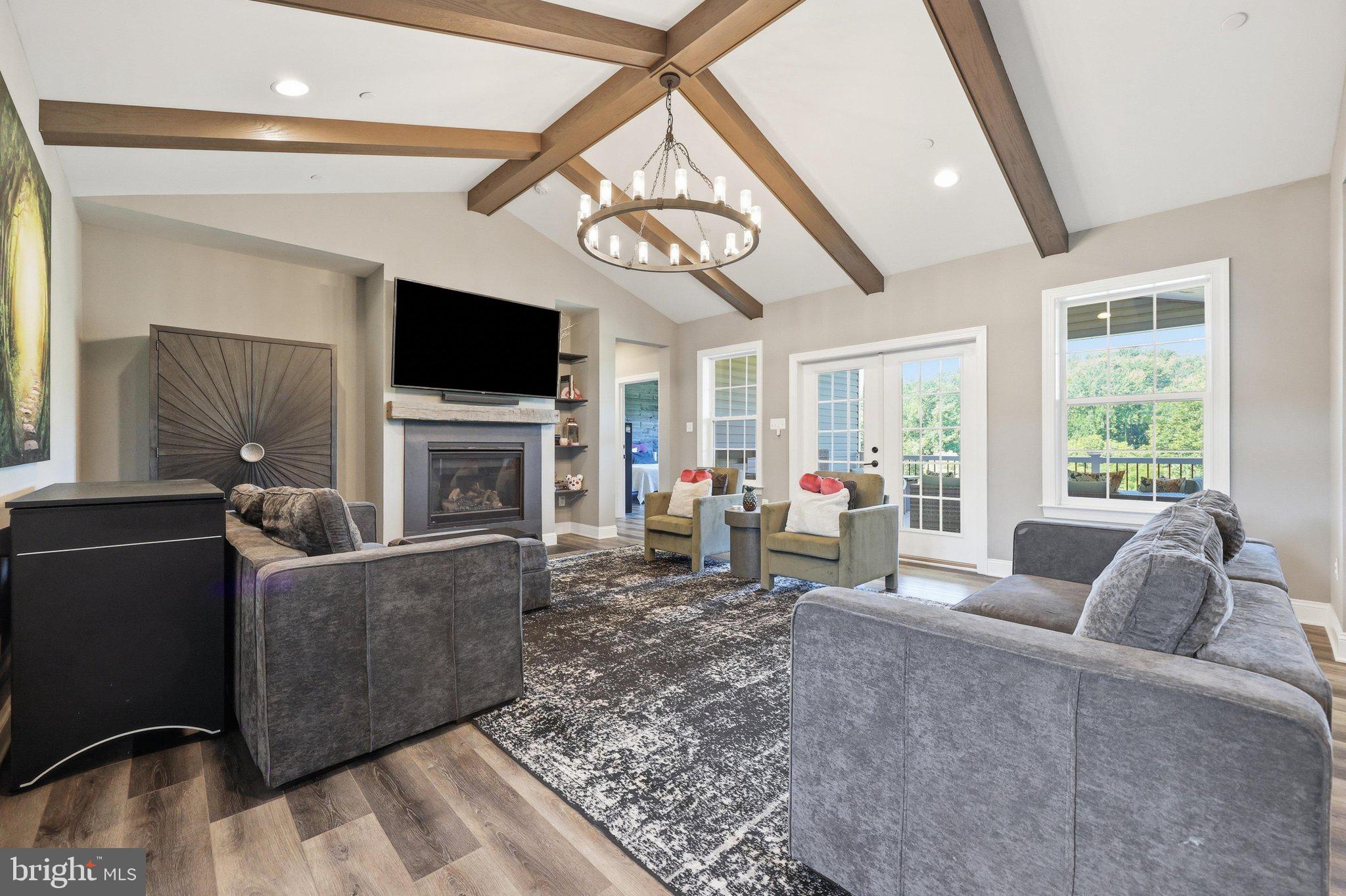 8225 Ball Road Frederick, MD 21704 - Photo 3 of 51 19 x 18 great room w/vaulted ceiling & deck access