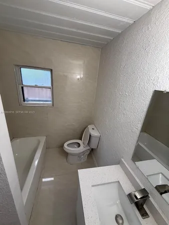 a bathroom with a sink and toilet