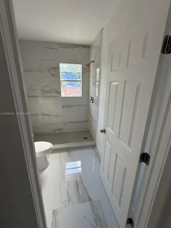 a bathroom with a sink and a shower