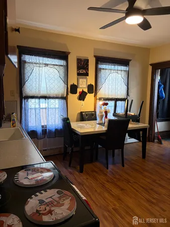 a living room with furniture a window and a chandelier