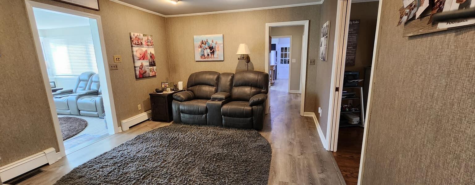 5257 North Spring Drive Northwest Roanoke, VA 24019 - Photo 11 of 47 a living room with furniture and a rug