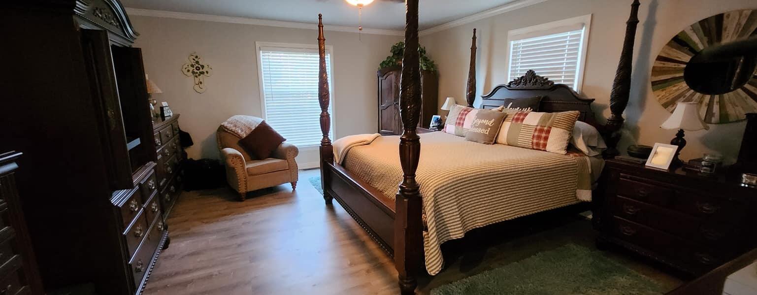 5257 North Spring Drive Northwest Roanoke, VA 24019 - Photo 19 of 47 a bedroom with a bed a flat screen tv and a couch