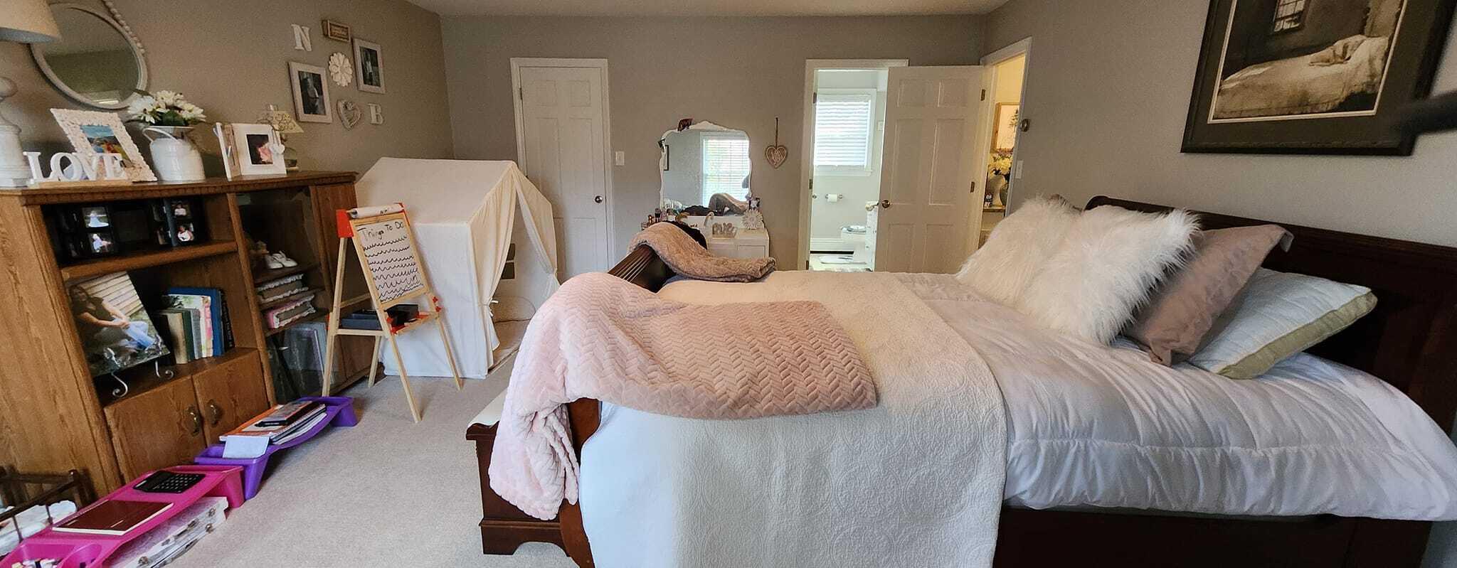 5257 North Spring Drive Northwest Roanoke, VA 24019 - Photo 26 of 47 a bed room with a bed and a walk in closet