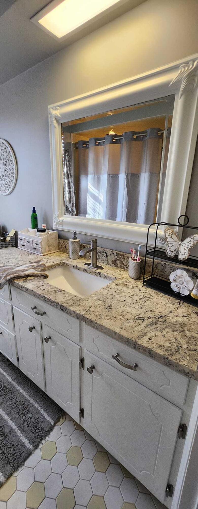 5257 North Spring Drive Northwest Roanoke, VA 24019 - Photo 28 of 47 a bathroom with a granite countertop sink and a mirror