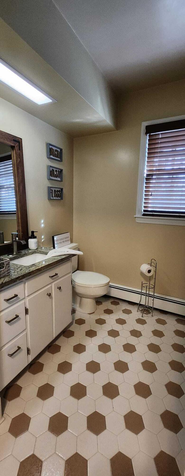 5257 North Spring Drive Northwest Roanoke, VA 24019 - Photo 31 of 47 a bathroom with a sink a toilet and shower