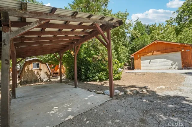 a side view of a house with a garage